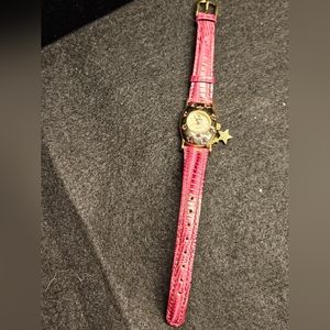 Vintage Alto quartz watch. Purple star with star charm. Gold tone. Leather band.